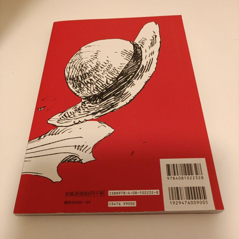 Red book cover with black and white illustrations of a hat and shell on a beige background