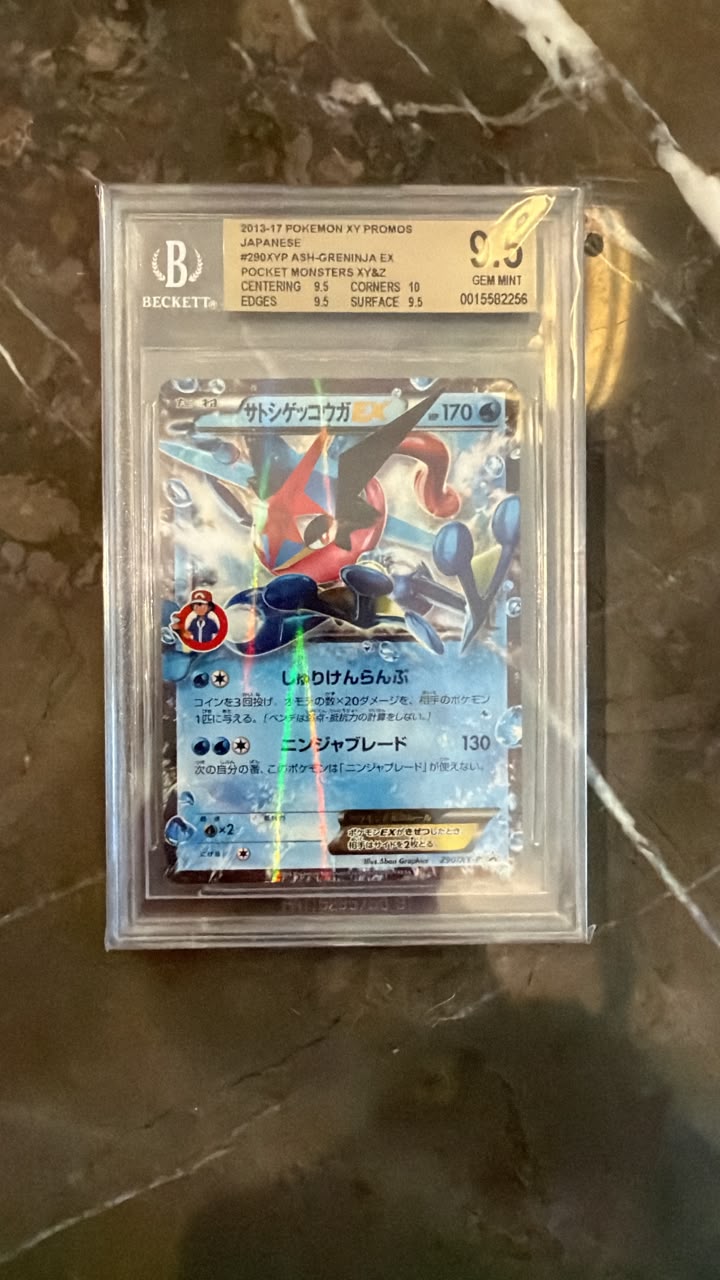 A graded Pokémon TCG trading card of Promosh (PSN001562256) in a clear plastic slab by Beckett, placed on a dark marble surface.